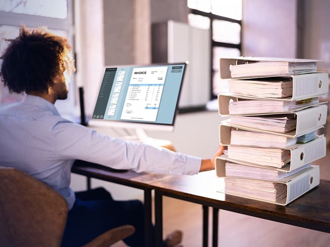 A professional graphic showing a static, non-editable PDF document being converted into clean, fully editable Word and InDesign formats while perfectly preserving its original layout and structure.